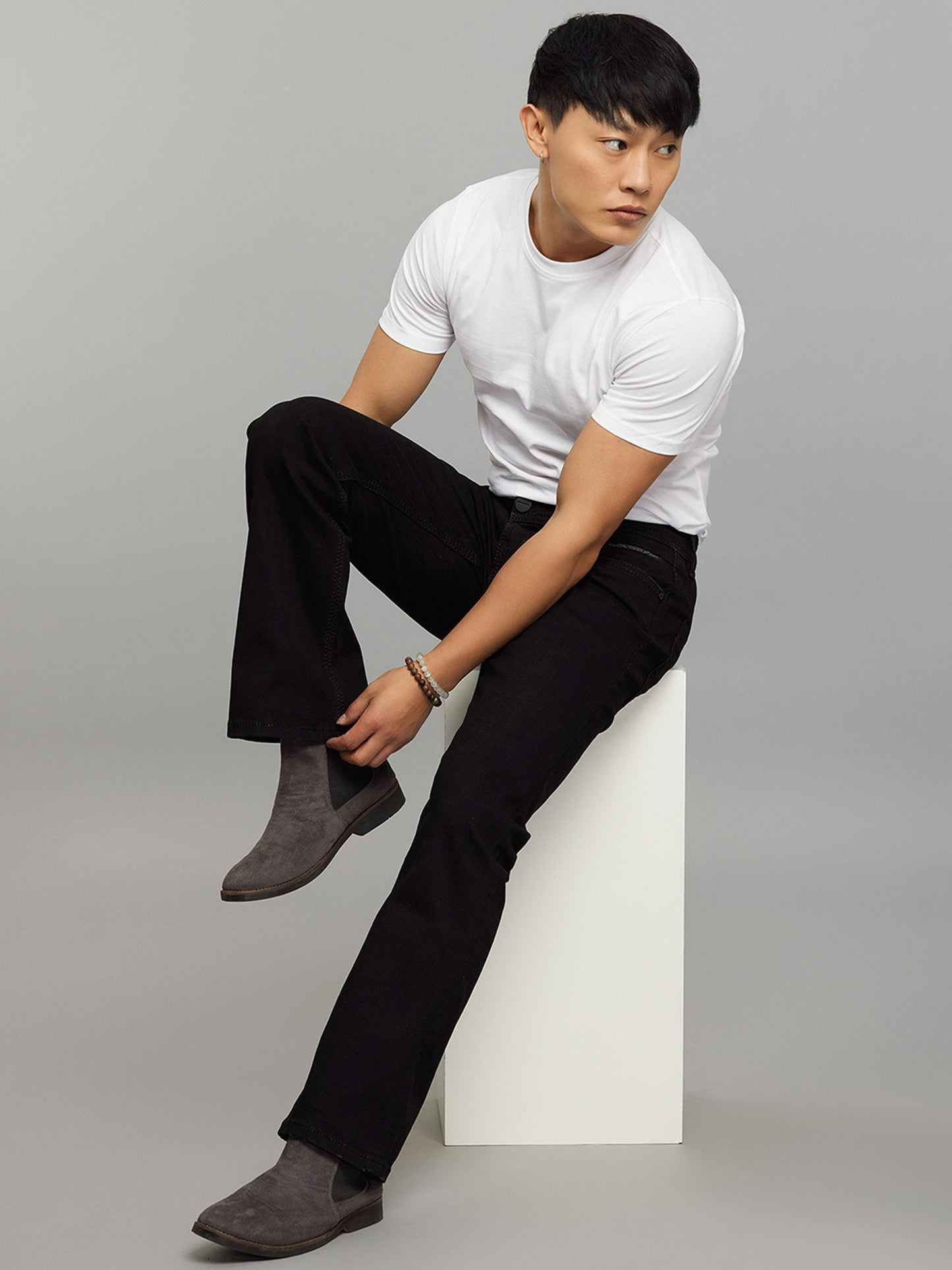 Black 5 Pocket Mid Rise Cropped Length Loose Boot Leg Stretch Jeans